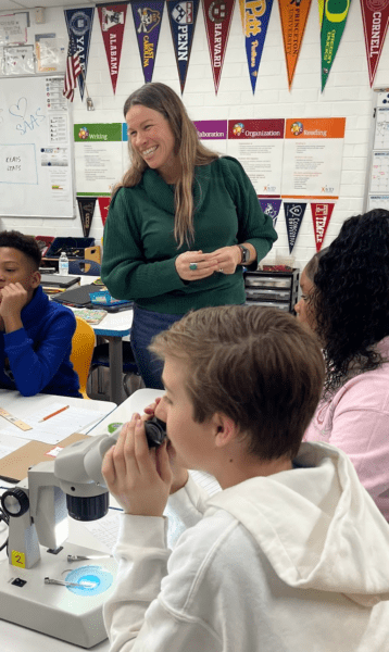 Christine Suzina leading the fruit fly lab with her students.