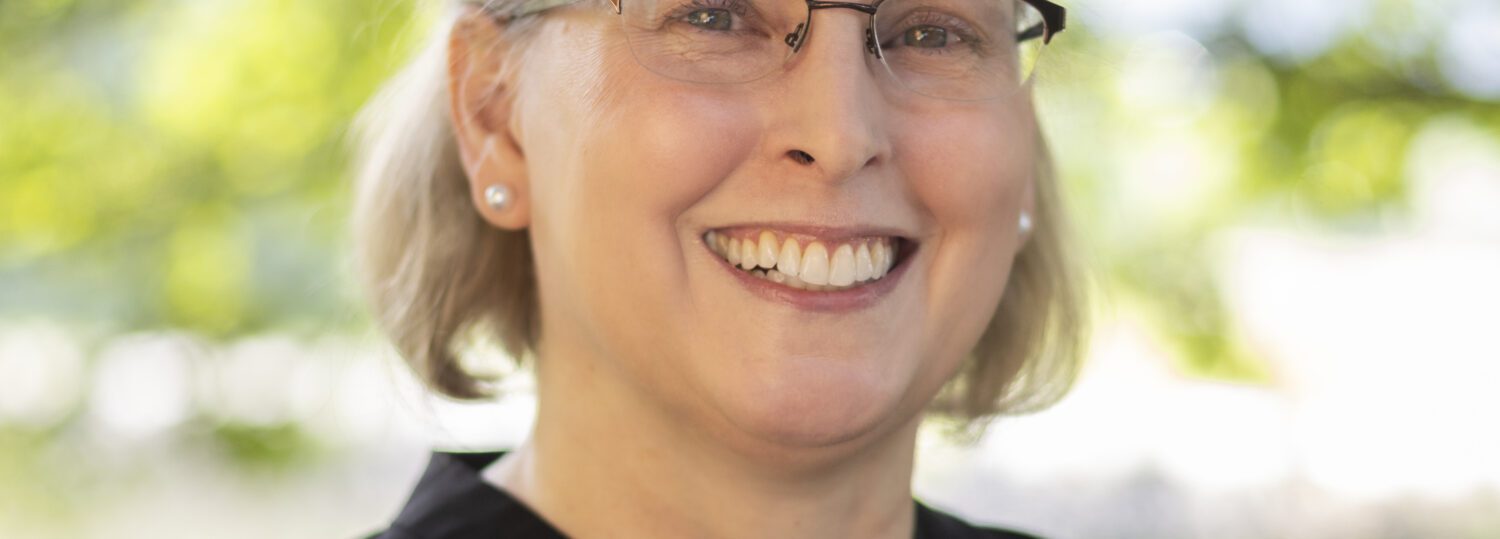 Headshot of Tammy King wearing a black blouse