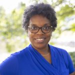 Headshot of Shavonne Speight wearing a blue blouse.