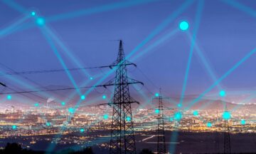 High power electricity poles in urban area connected to smart grid. Energy supply, distribution of energy, transmitting energy, energy transmission, high voltage supply concept photo.